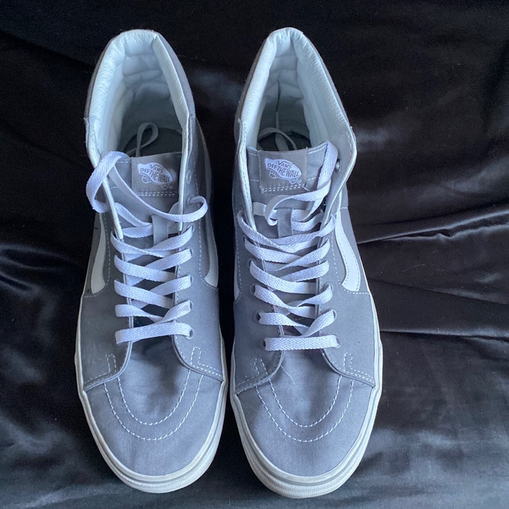 Grey and white high top vans